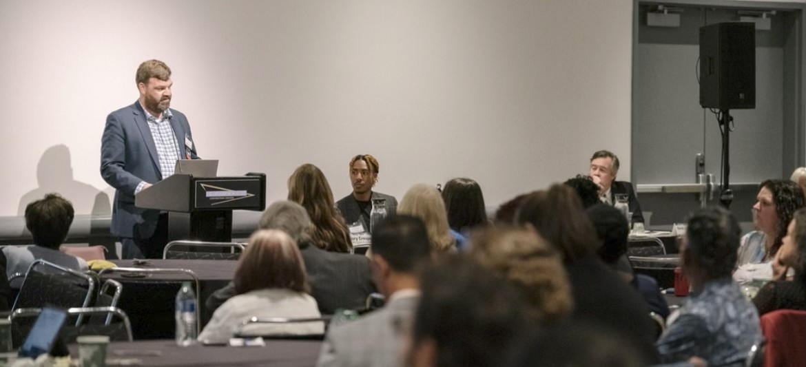 Dylan Hayden presenting at a conference